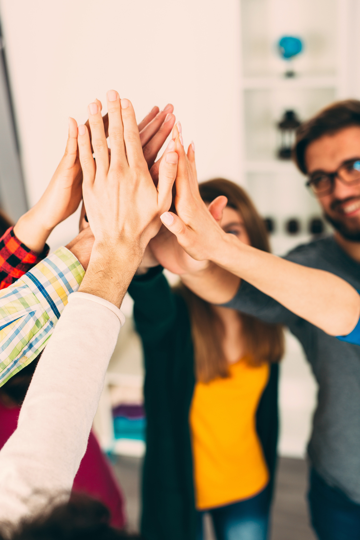 a company team with their hands in the air